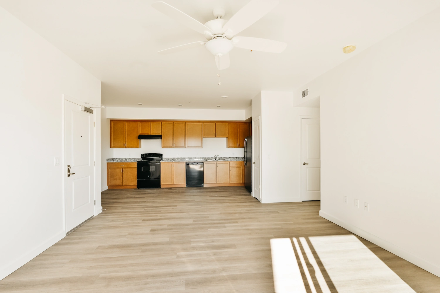 Freshly painted apartment living area and kitchen