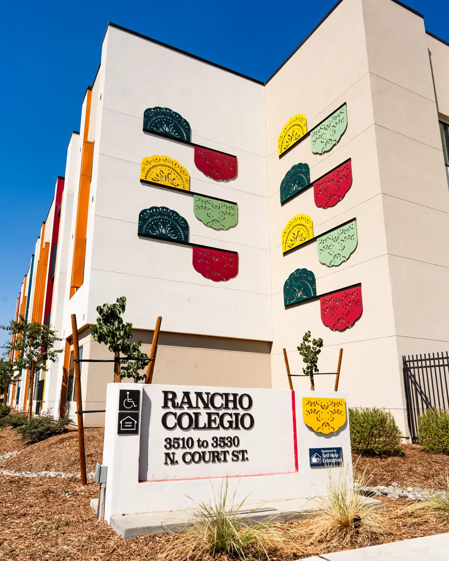 Rancho Colegio monument signage wall with colorful painted tile artwork