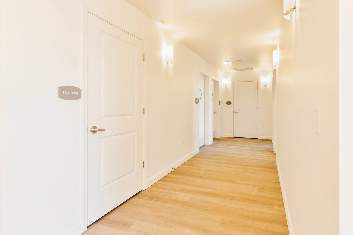 Bright interior corridor with newly painted walls and doors
