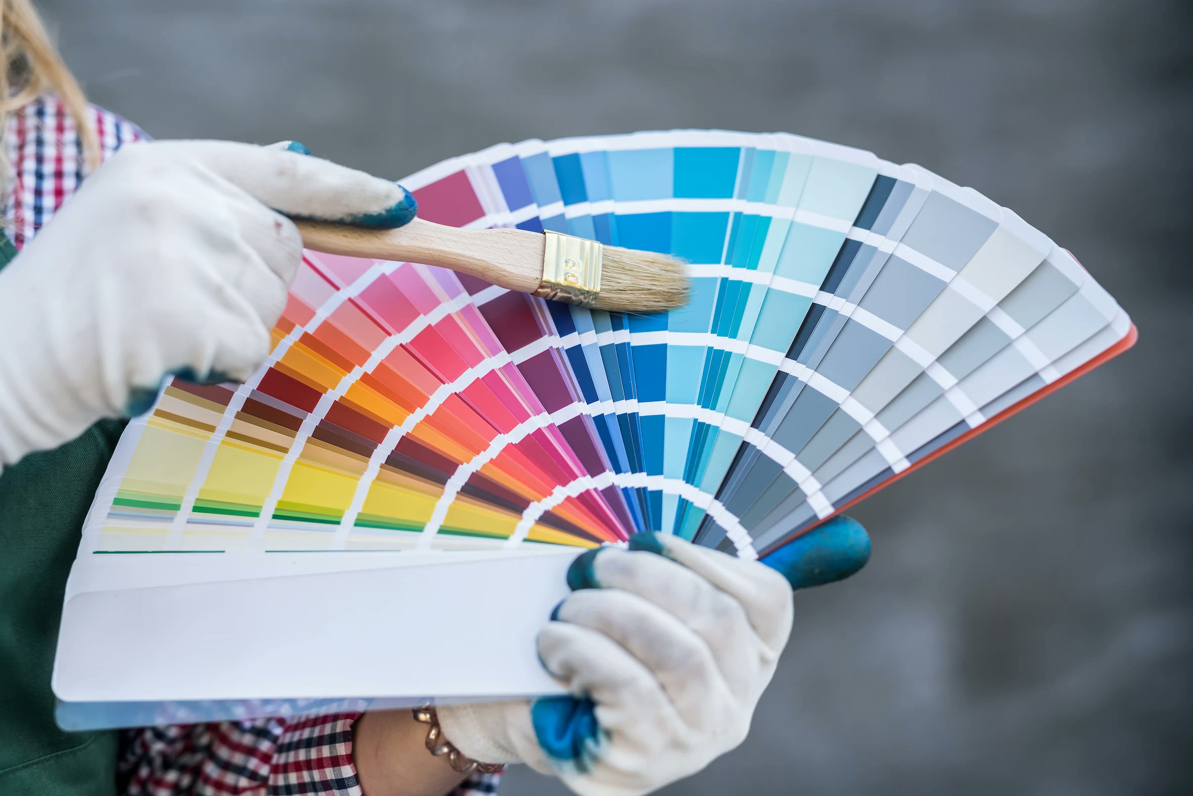 Precision Painting estimator reviewing color samples with a homeowner