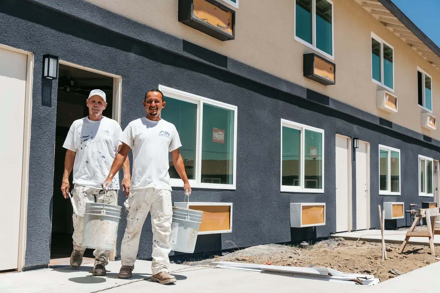 Fresno home exterior mid-transformation with fresh paint on one elevation